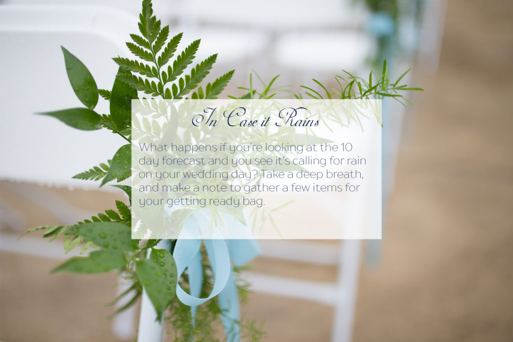 close up of greenery on white wedding ceremony chair