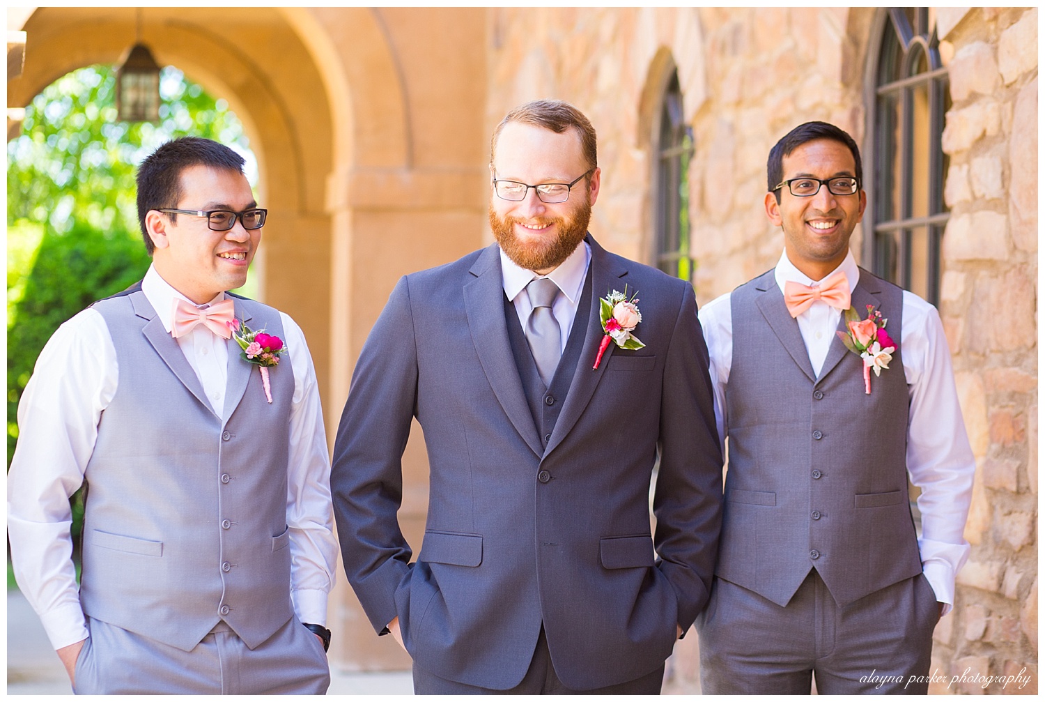 groom and groomsmen walking and laughing