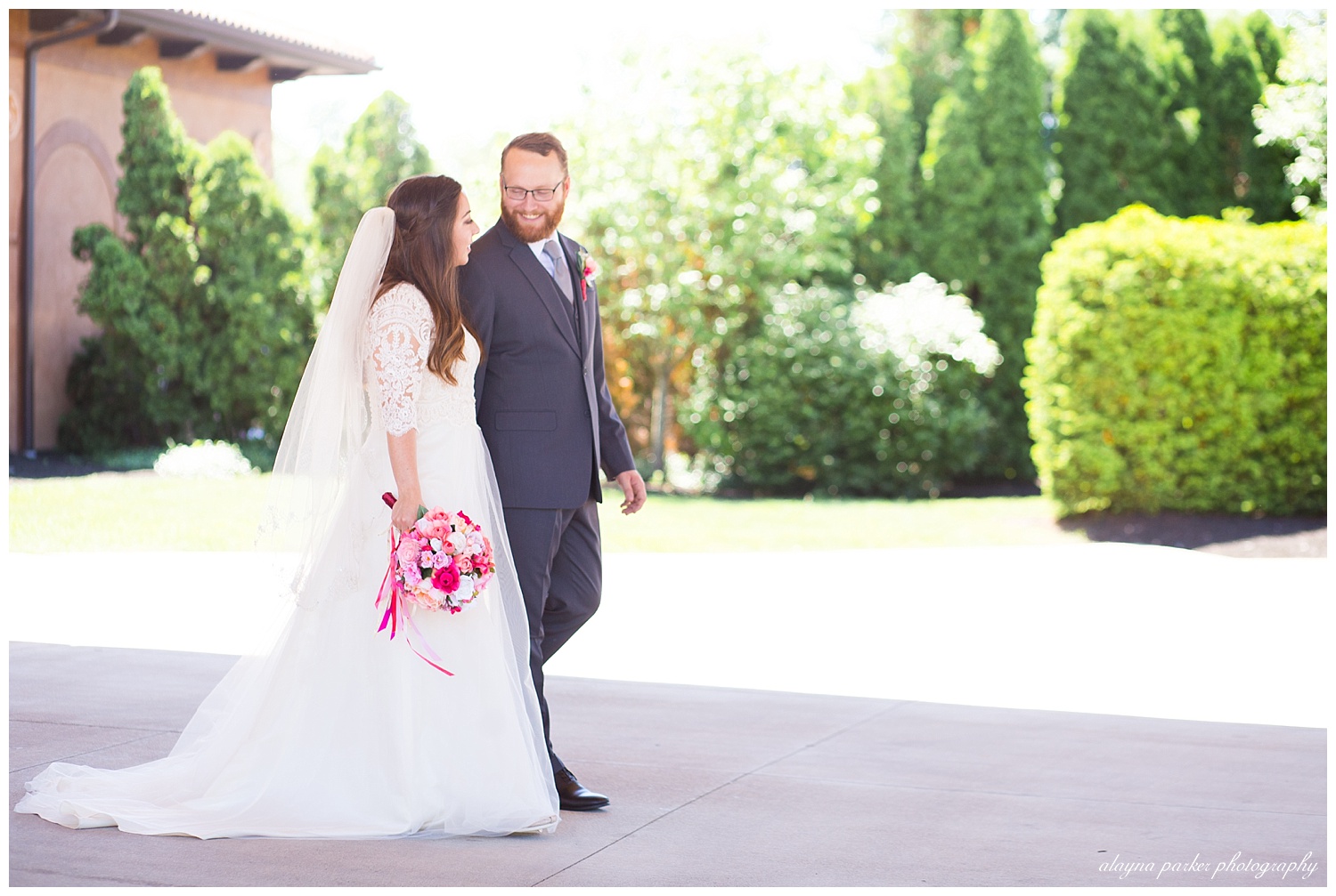 groom looking at bride as they're walking at club at corazon