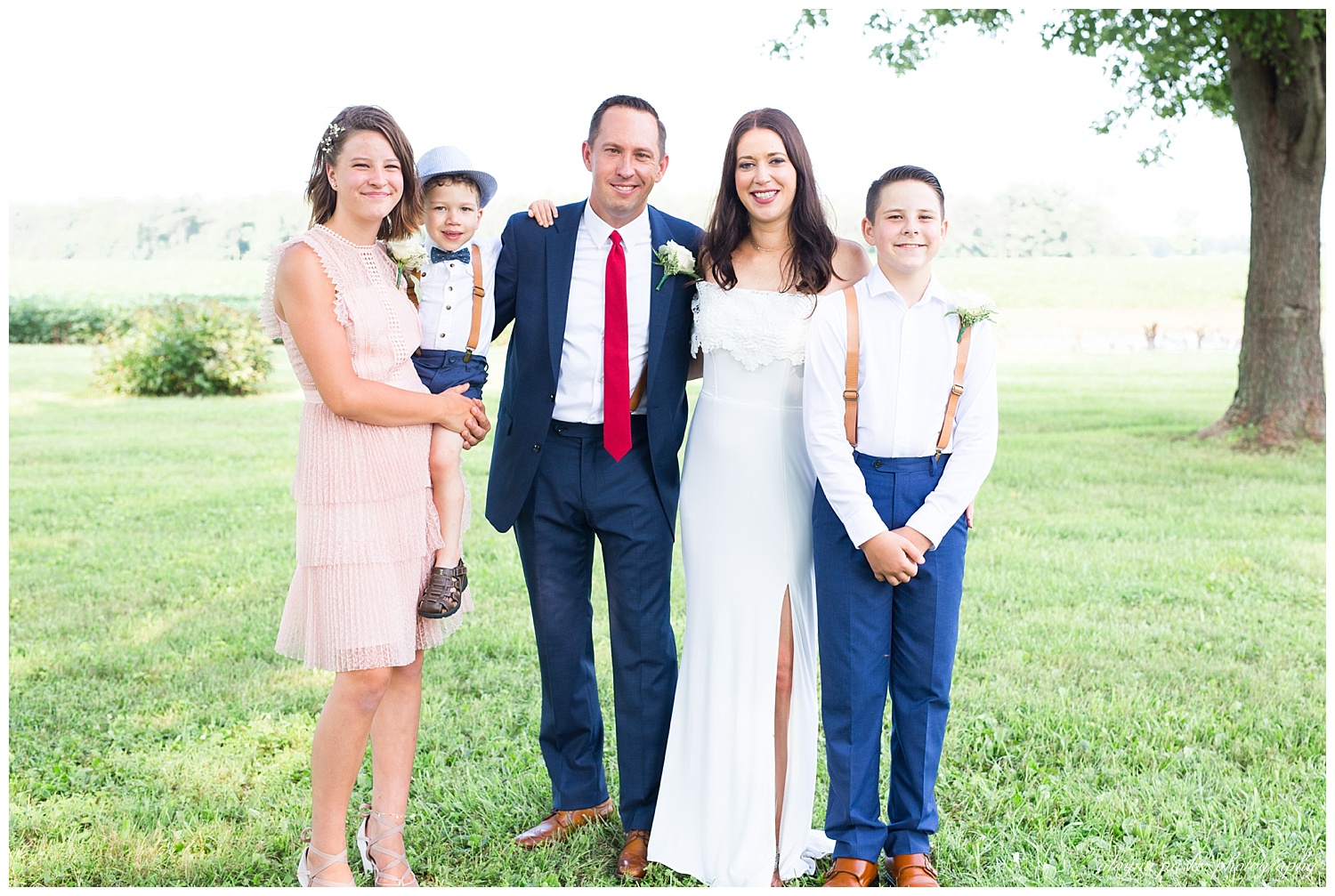 bride and groom with their children