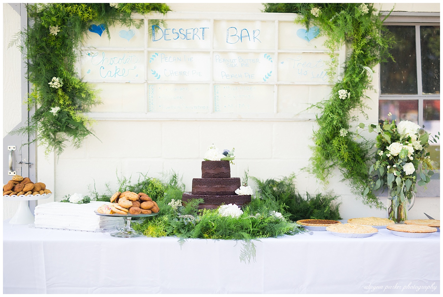 dessert bar with cake, pies, and cookies