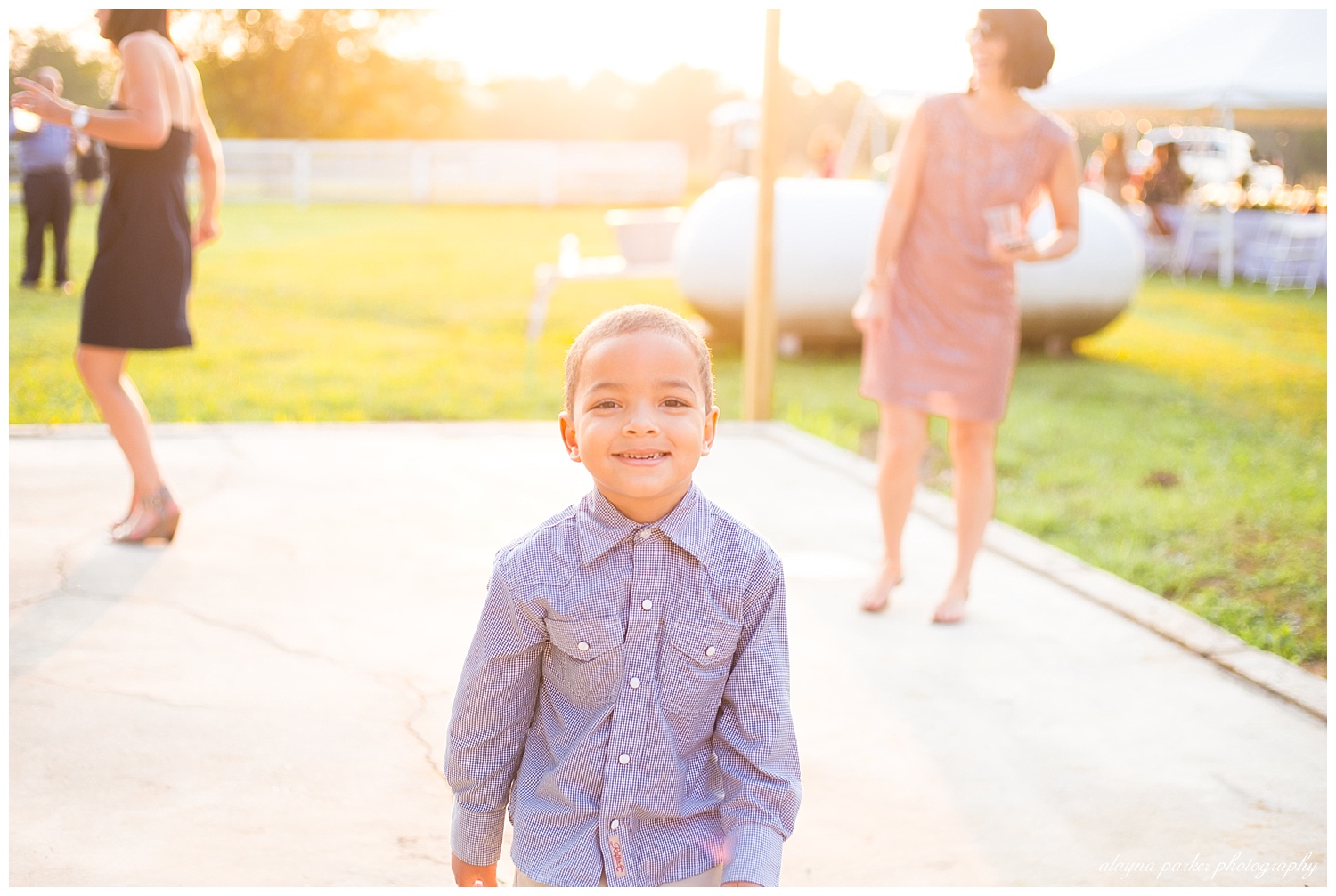 little boy smiling at camera while dancing