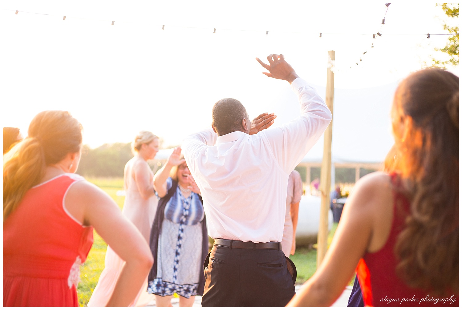 wedding guests dancing outside