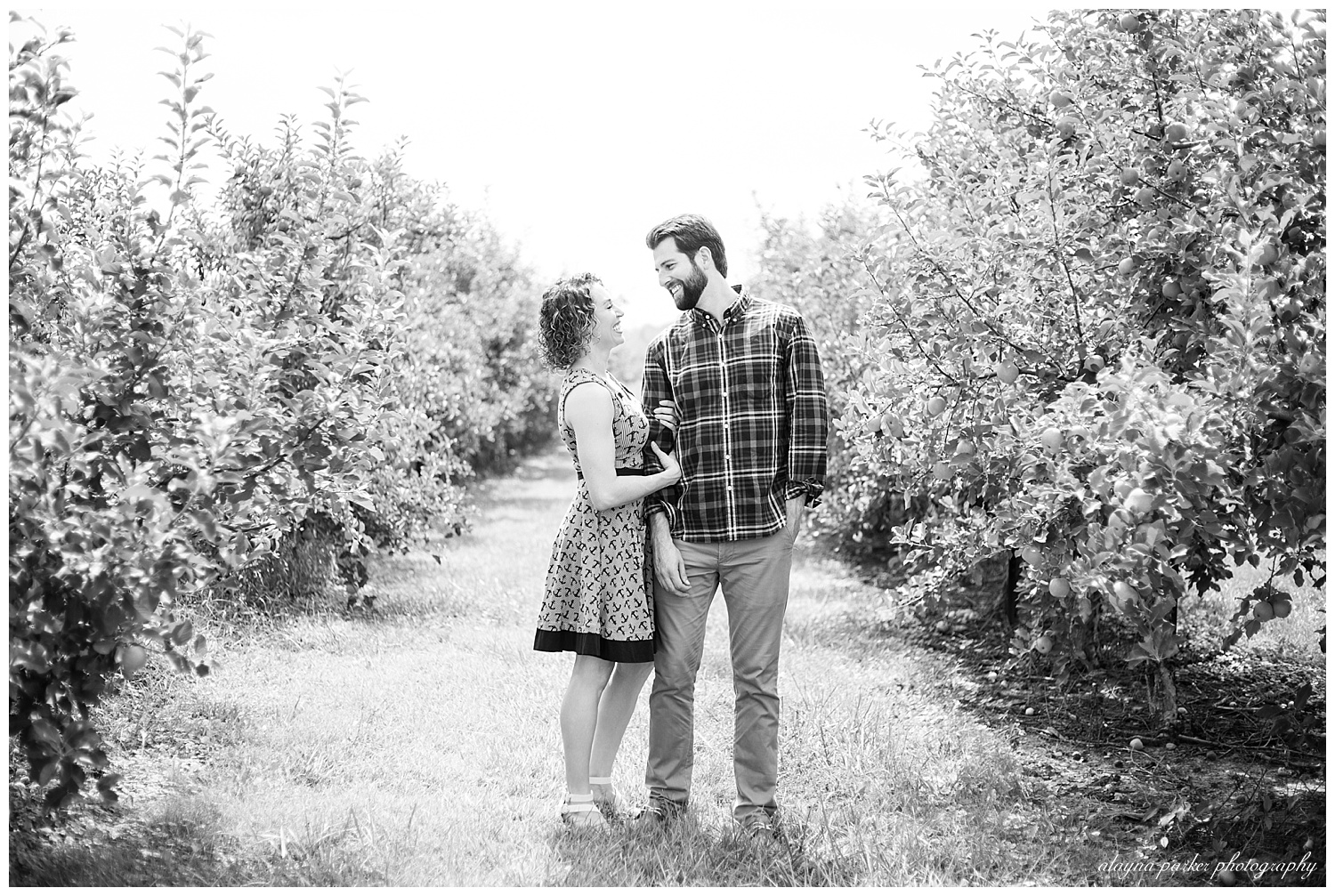 black and white image of couple looking at each other at lynd's fruit farm