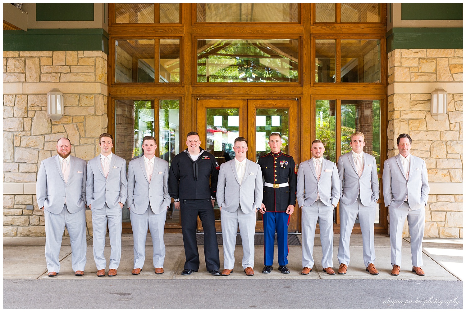 groomsmen in gray suits and military uniforms