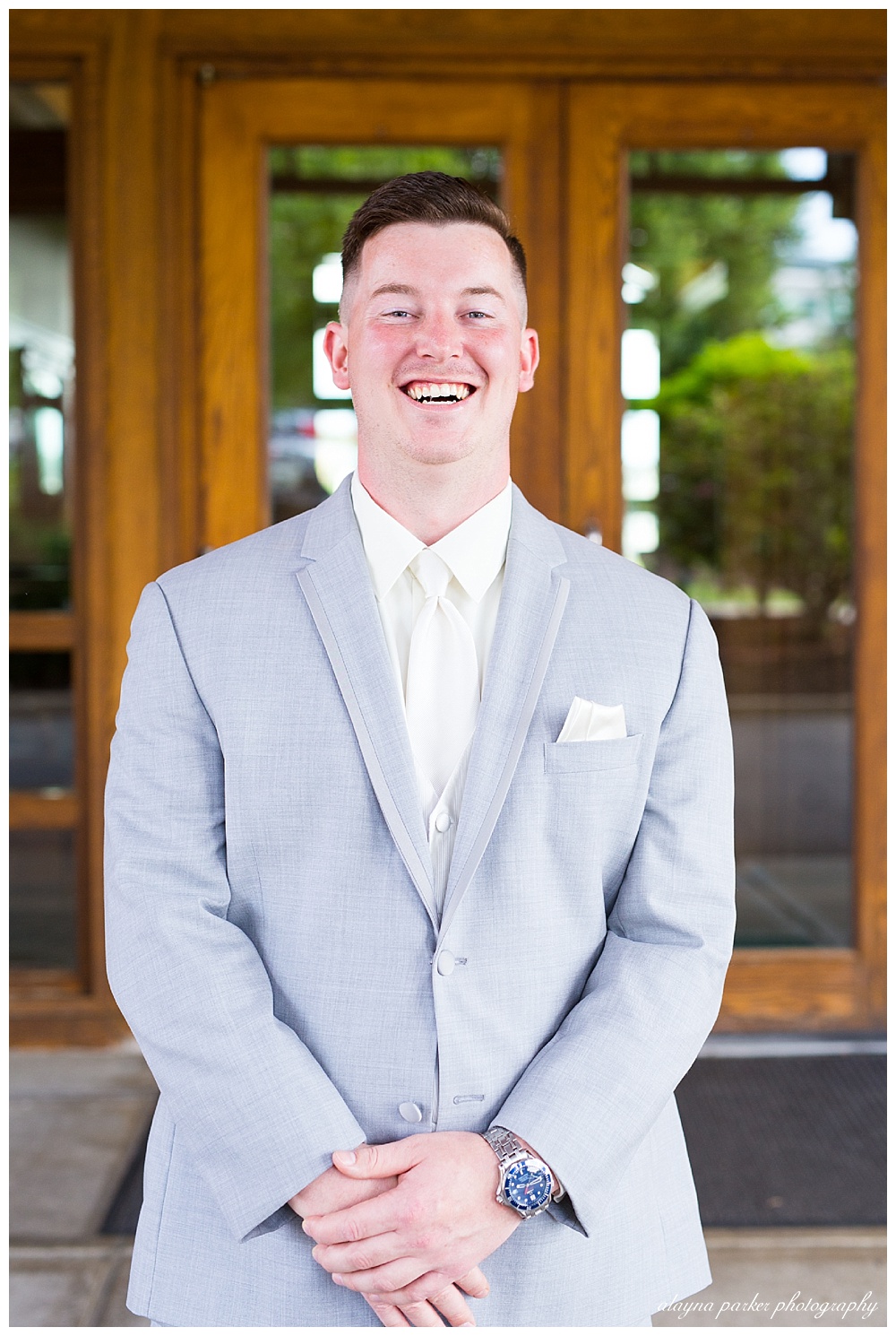 groom laughing at camera