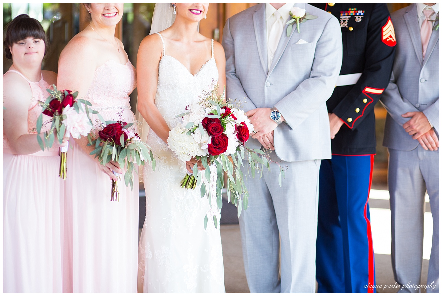 groomsmen wearing gray suits, bridesmaids wearing blush pink dresses