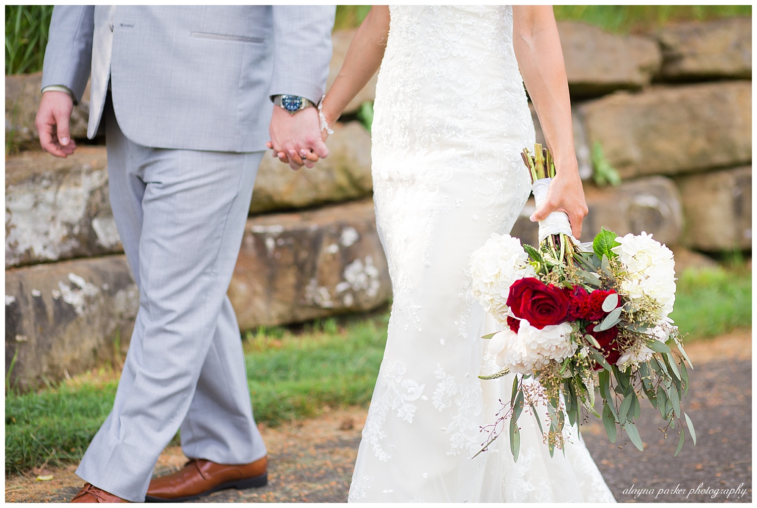 close up of bride and groom holding hands as they walk at south pointe golf club