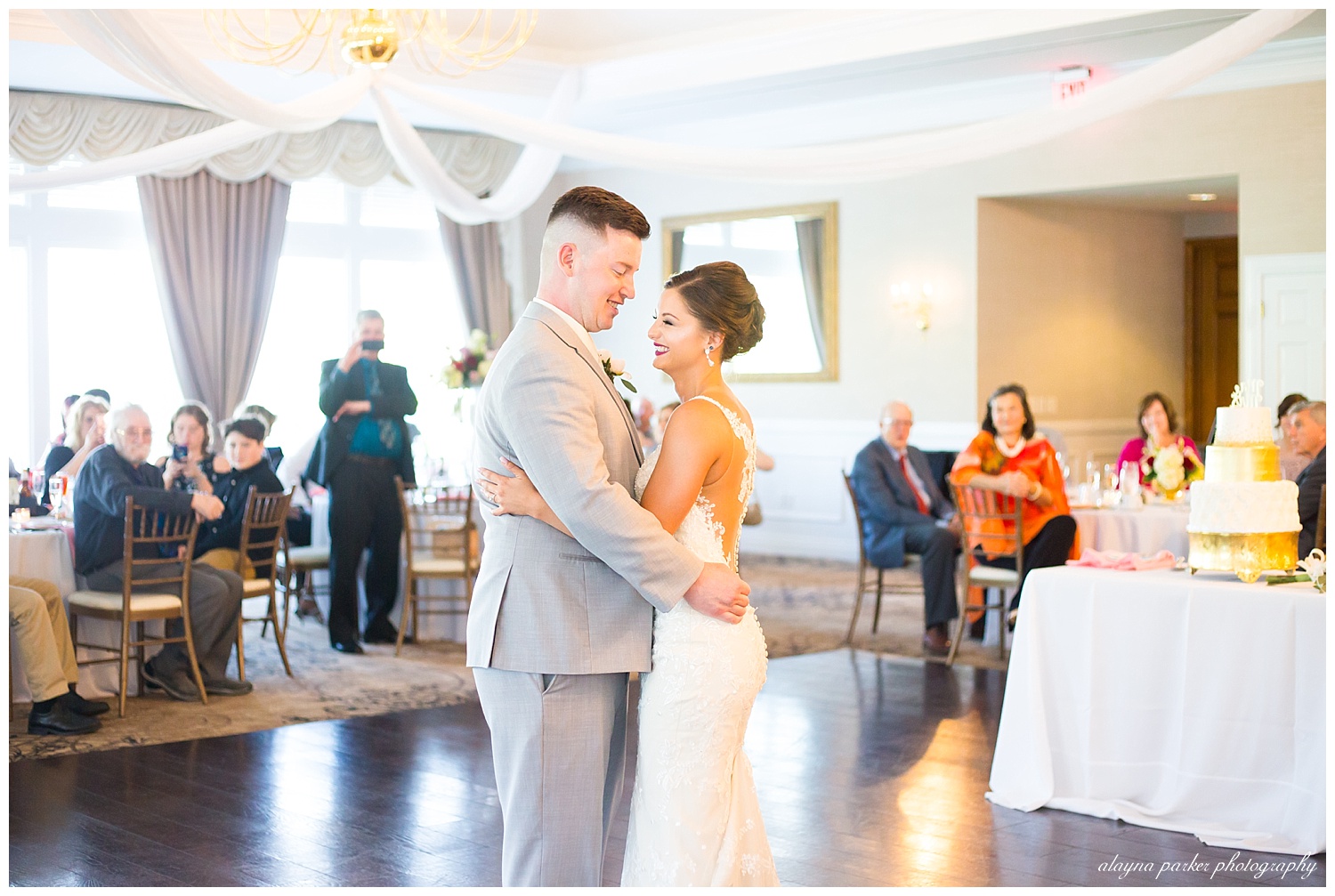 bride and groom laughing as they share first dance at south pointe golf club
