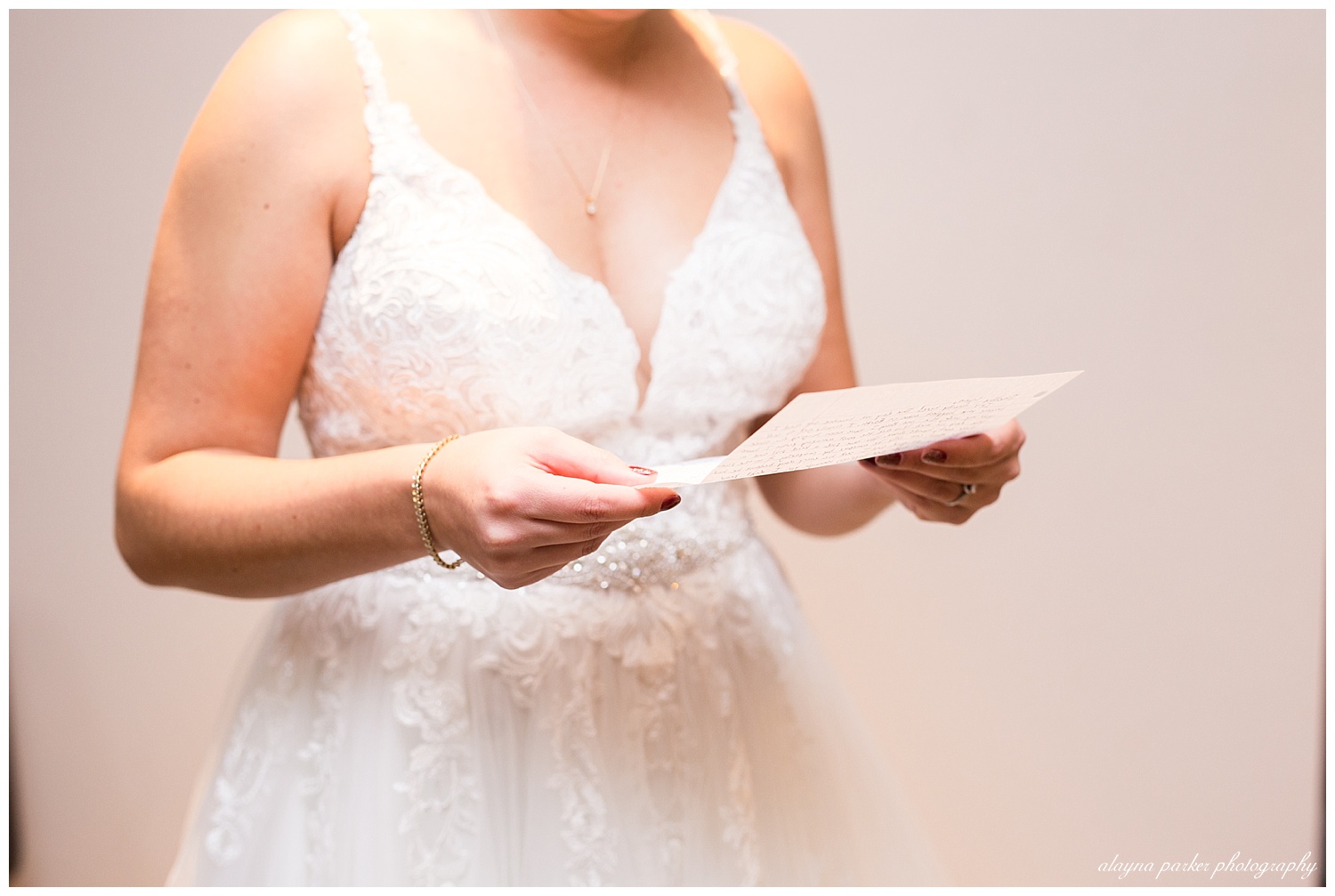 close up of bride reading letter from groom