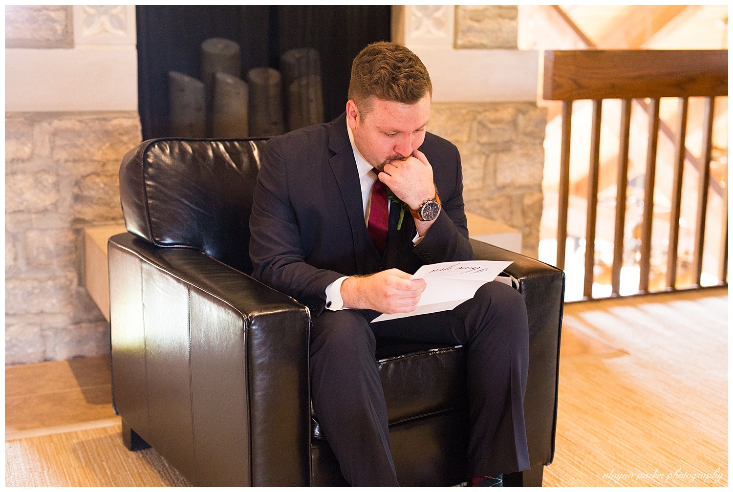 groom getting emotional as he reads letter from bride