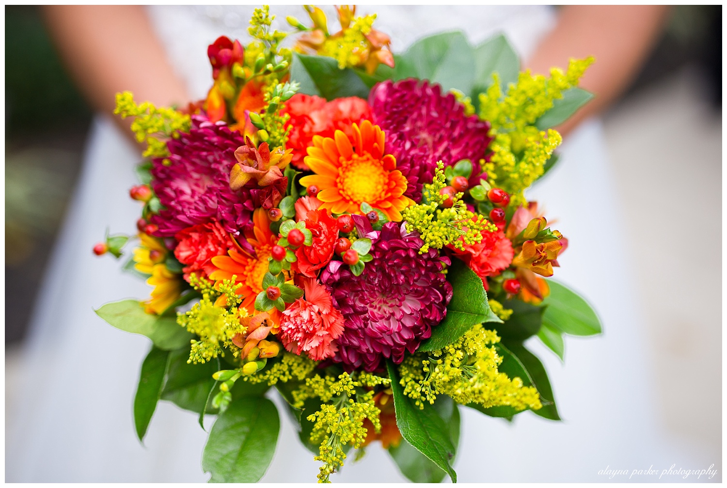 close up of bride holding bouquet