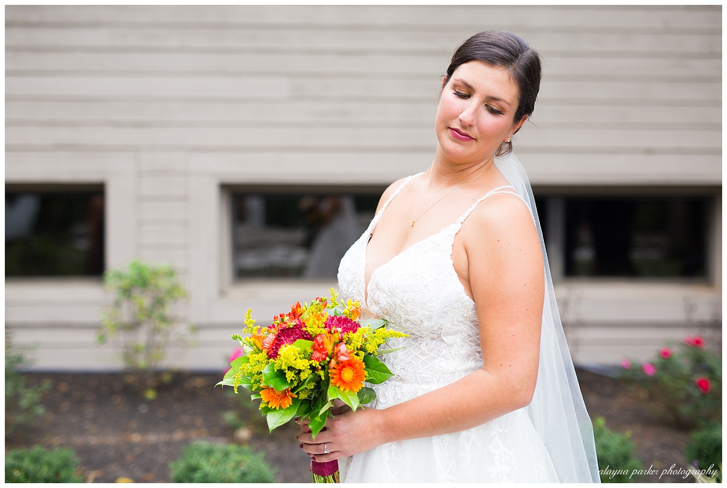 bride looking down and smiling softly