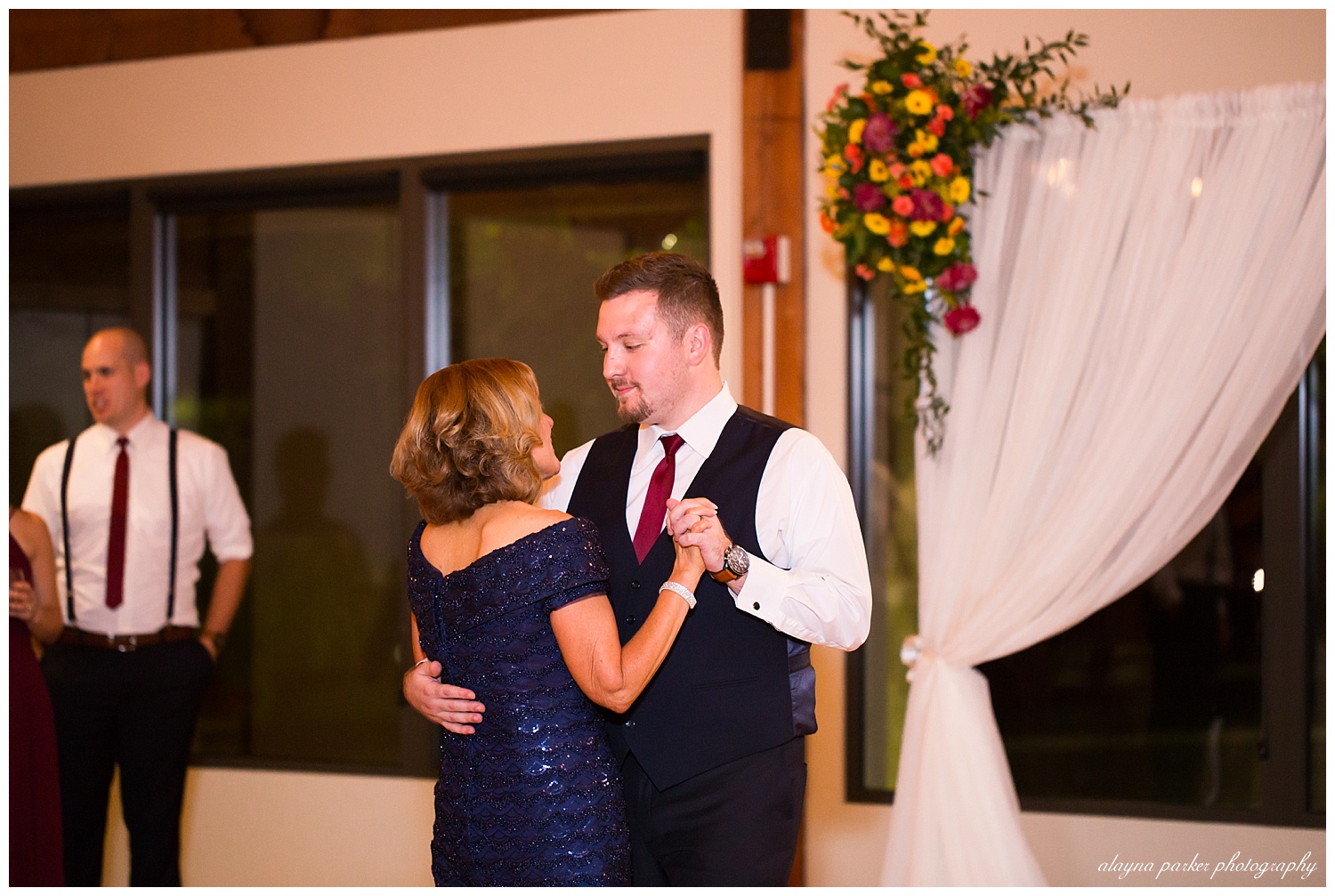 mother son dance at water's edge