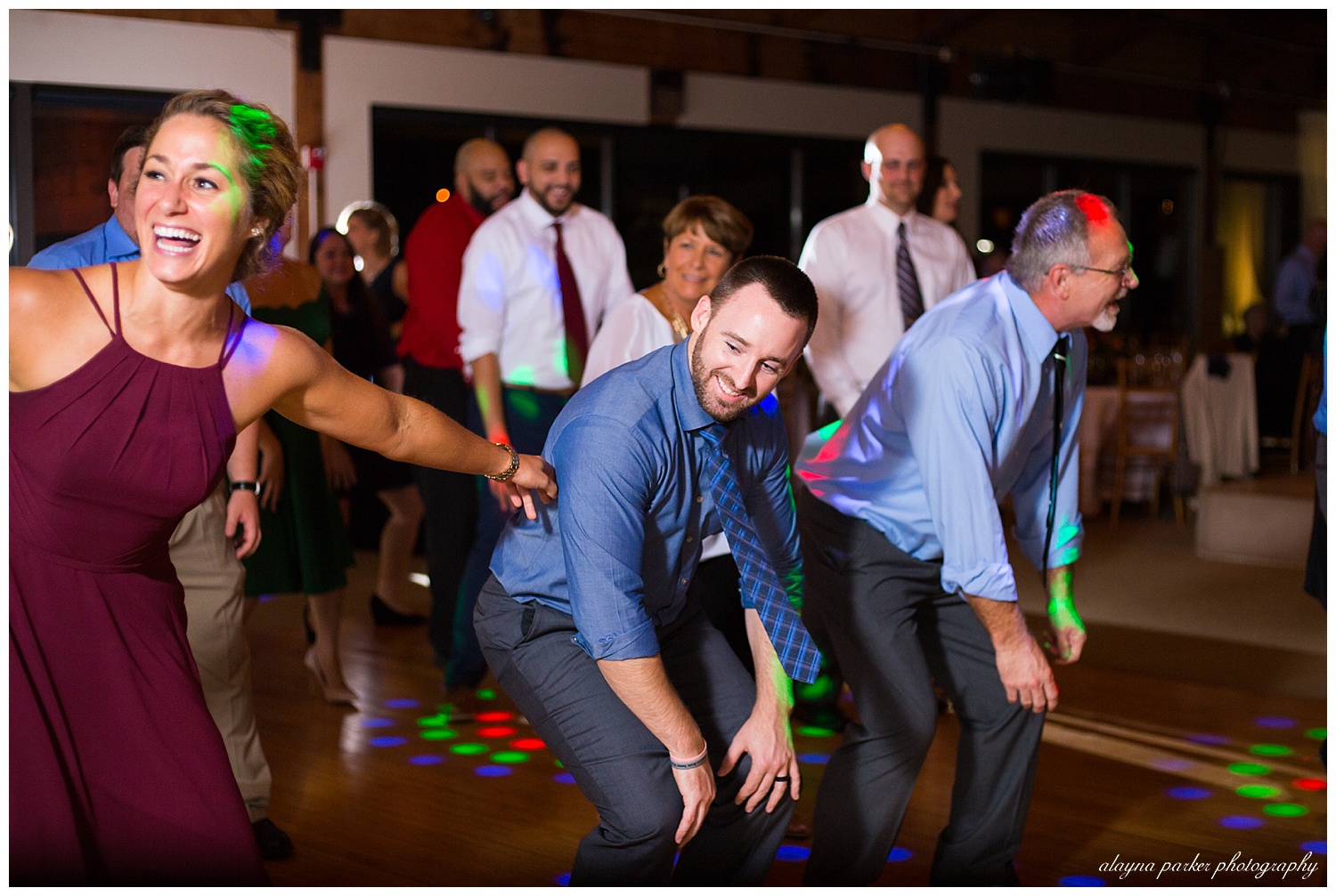 guests dancing at water's edge