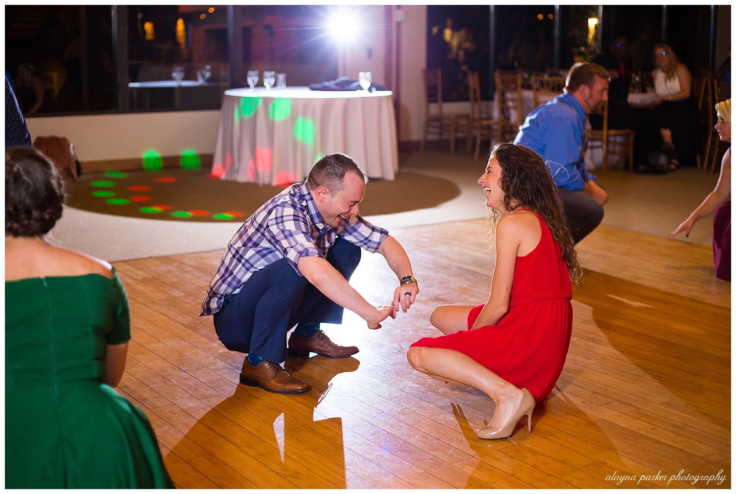 couple dancing at water's edge