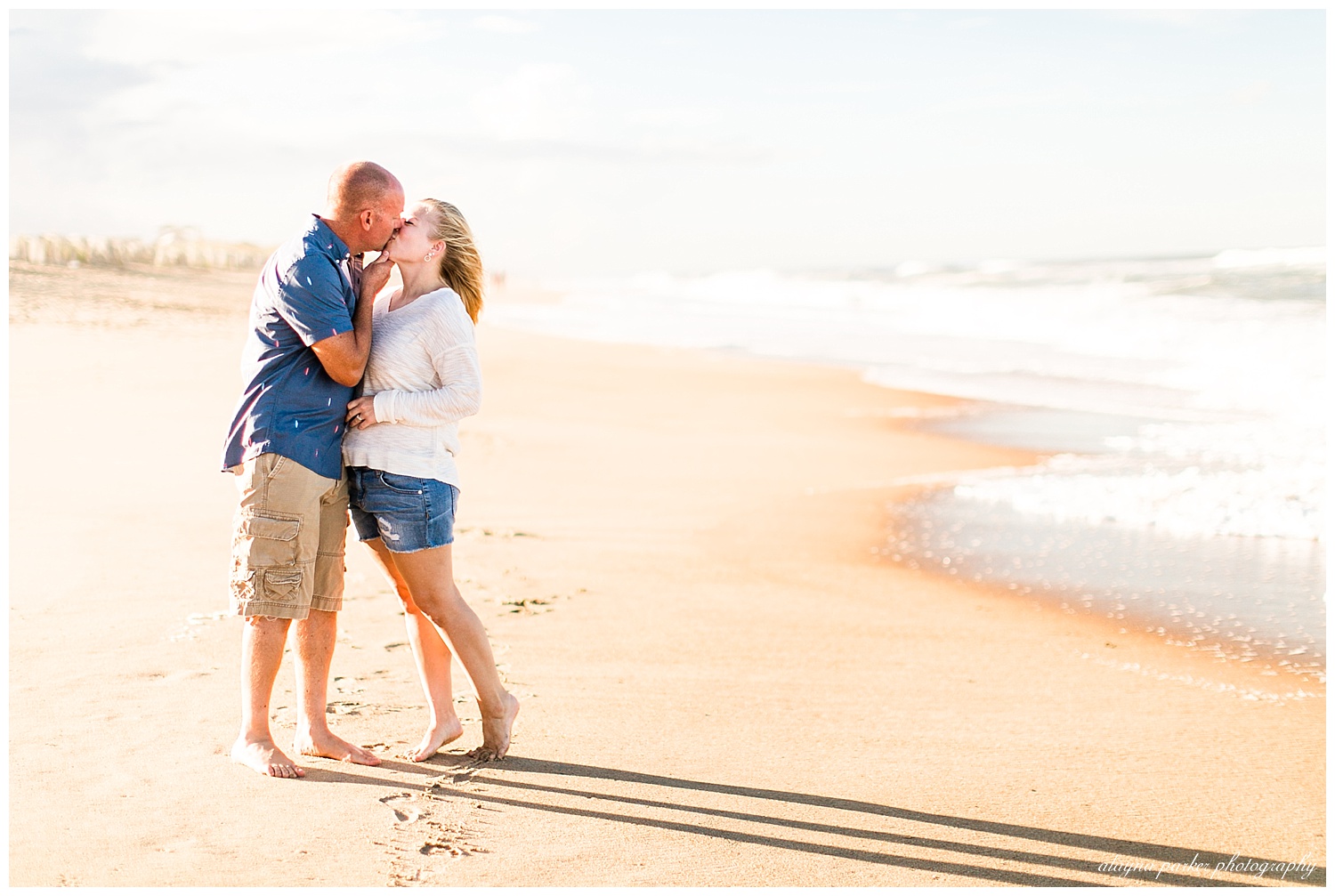 couple kissing on beach in outer banks