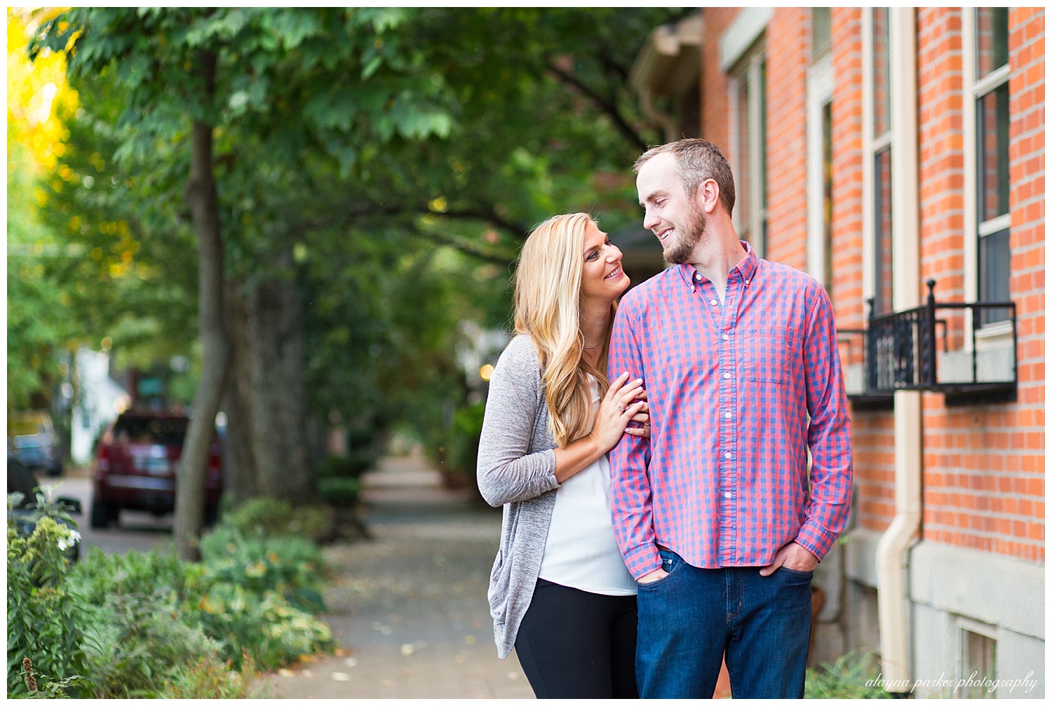 man and woman looking at each other and smiling in german village