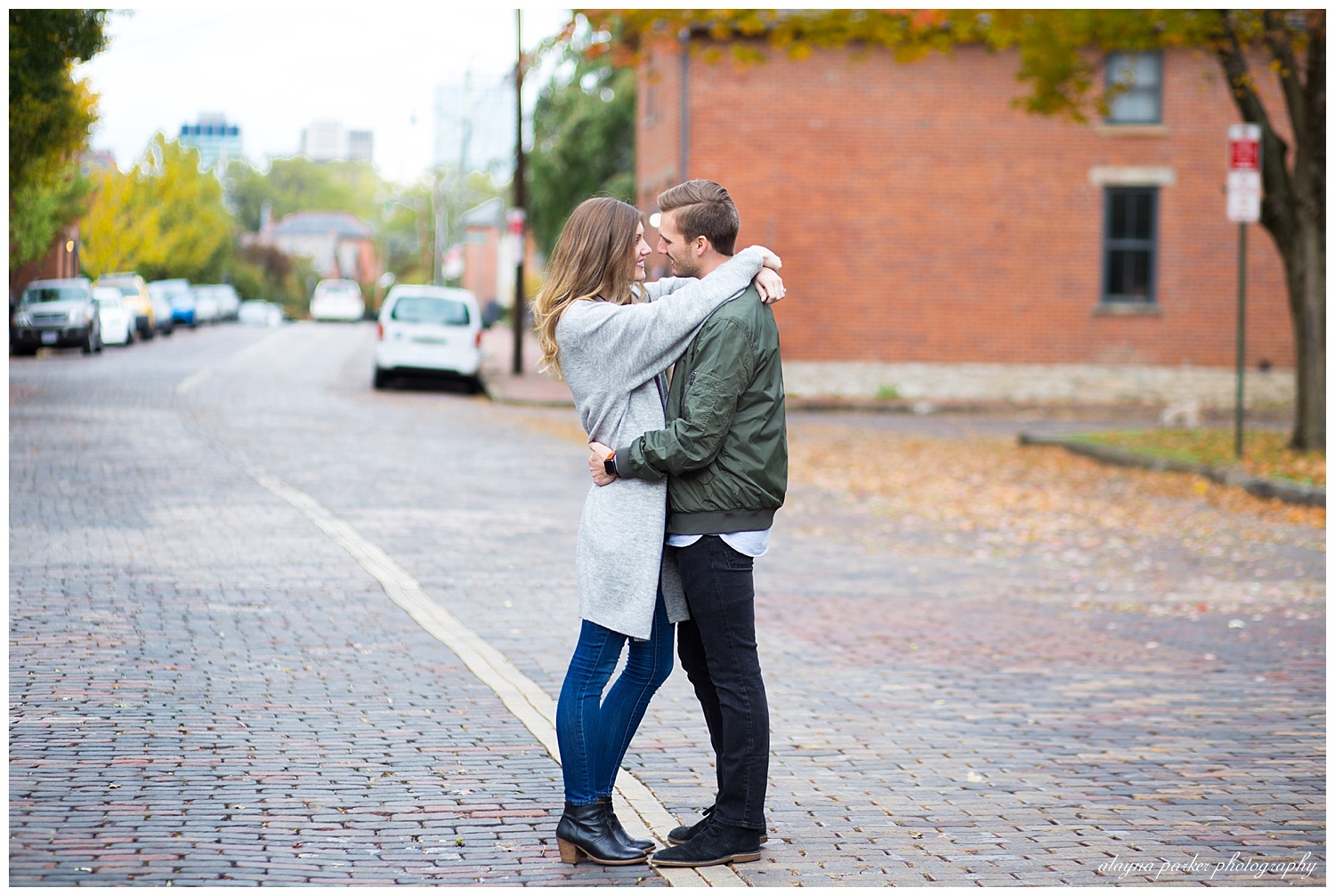couple hugging on brick road