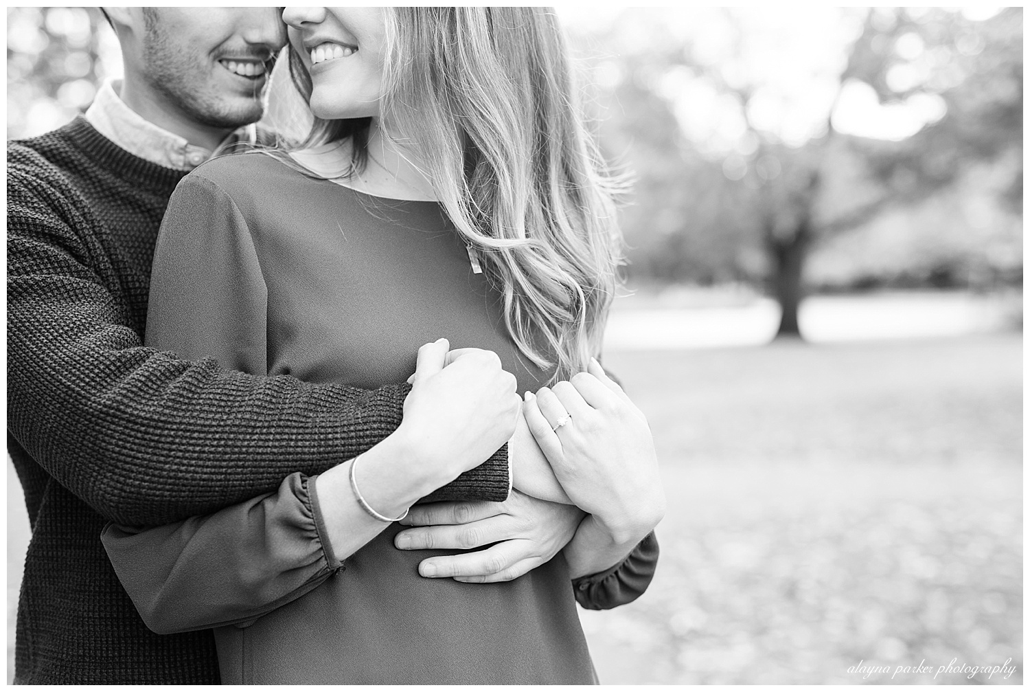 black and white image of close up of engaged couple holding hands in german village