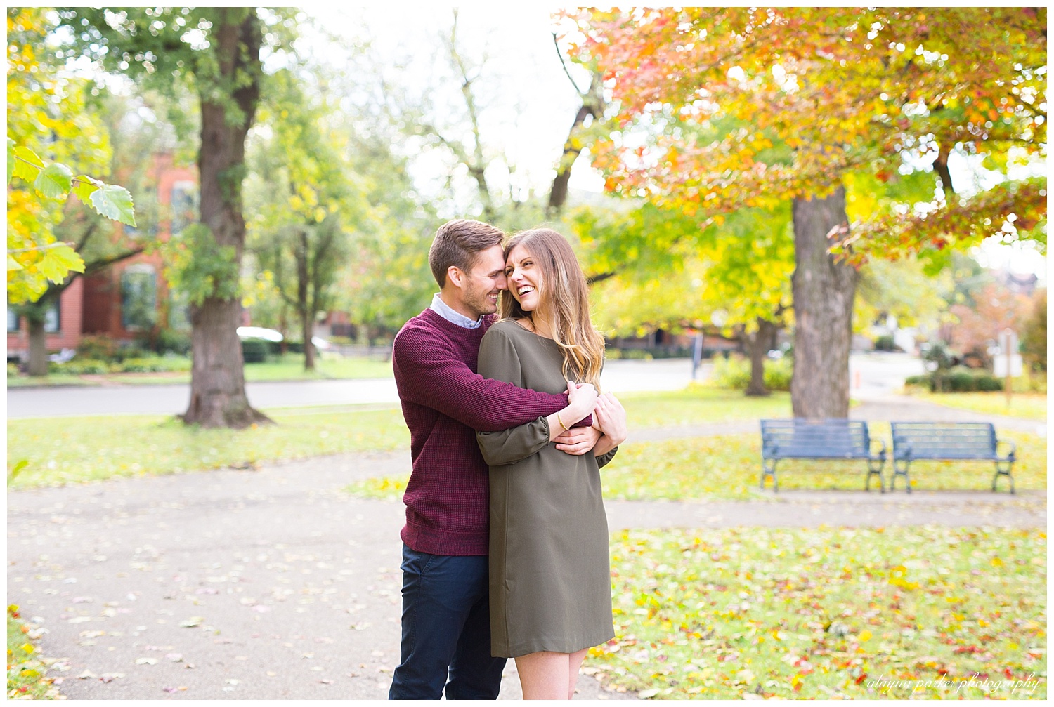 man and woman laughing at each other at schiller park in german village