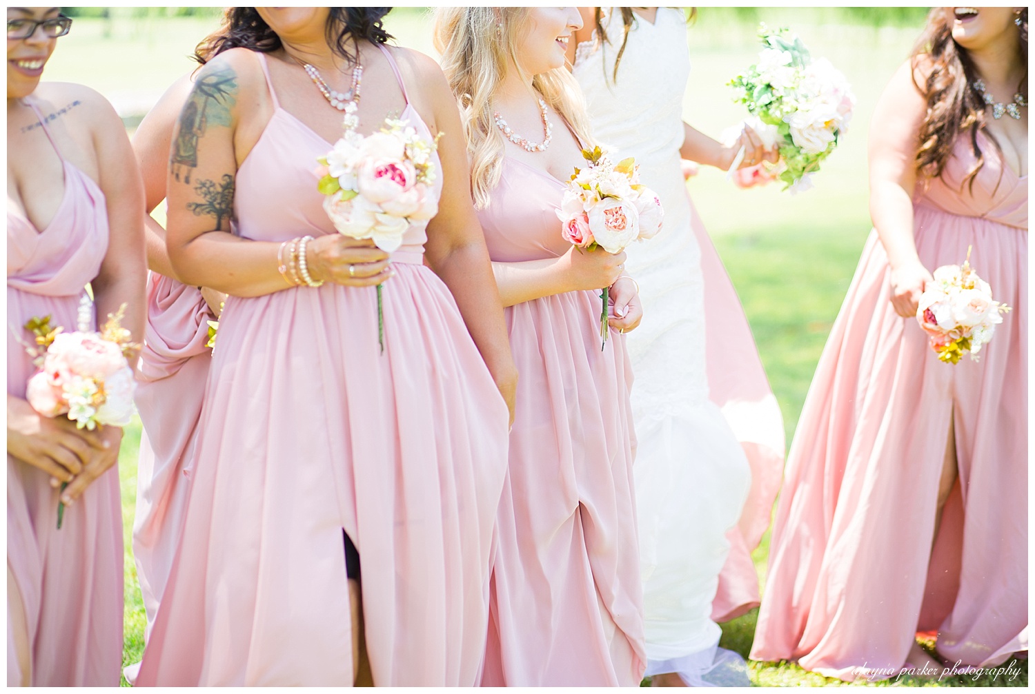 close up of bridesmaids in pink dresses walking