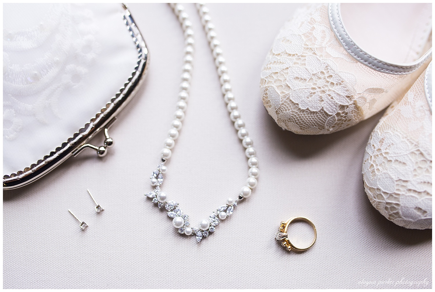 lace shoes, pearl necklace on white background