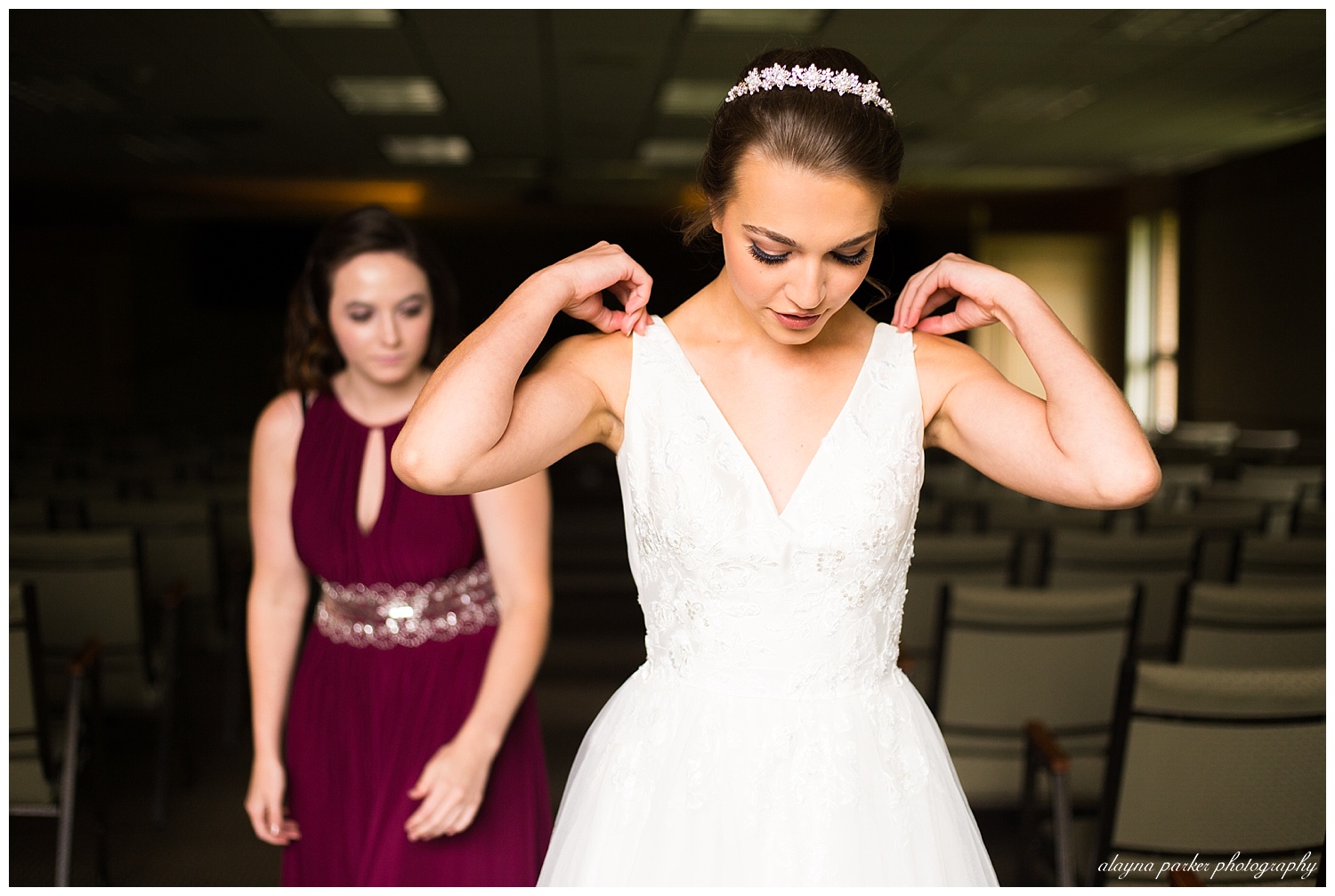 bride getting gown zipped up