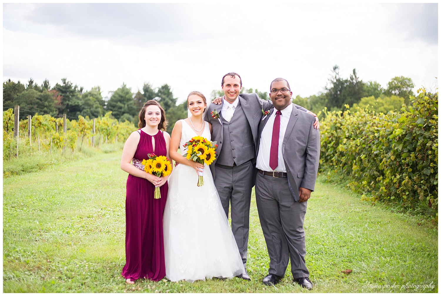 bride and groom with one bridesmaid and one groomsman