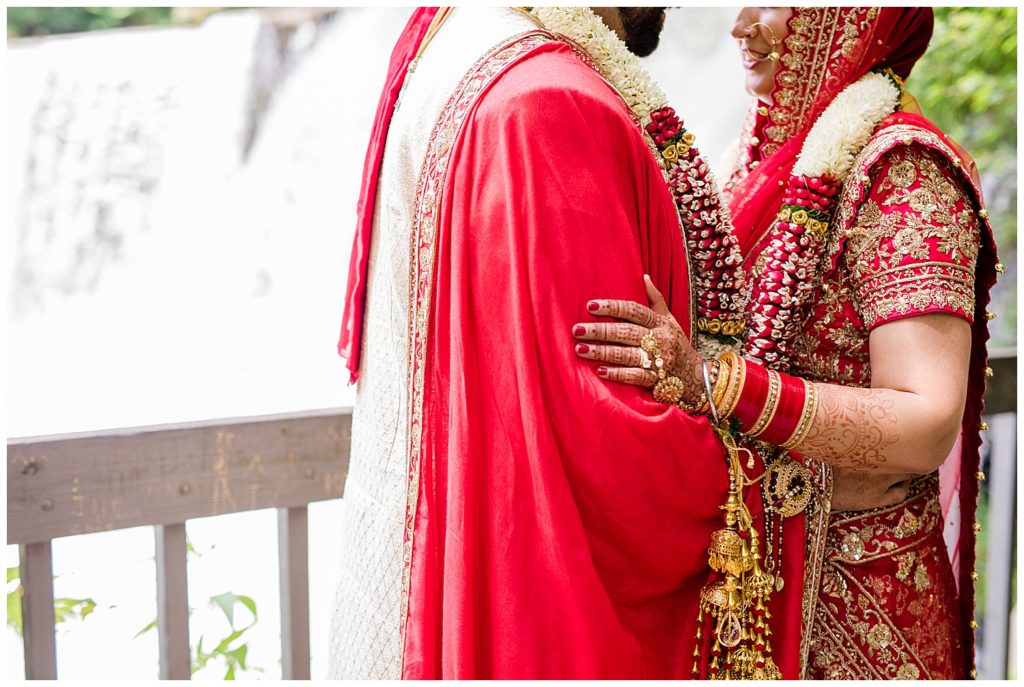 indian bride and groom wearing red at chagrin falls