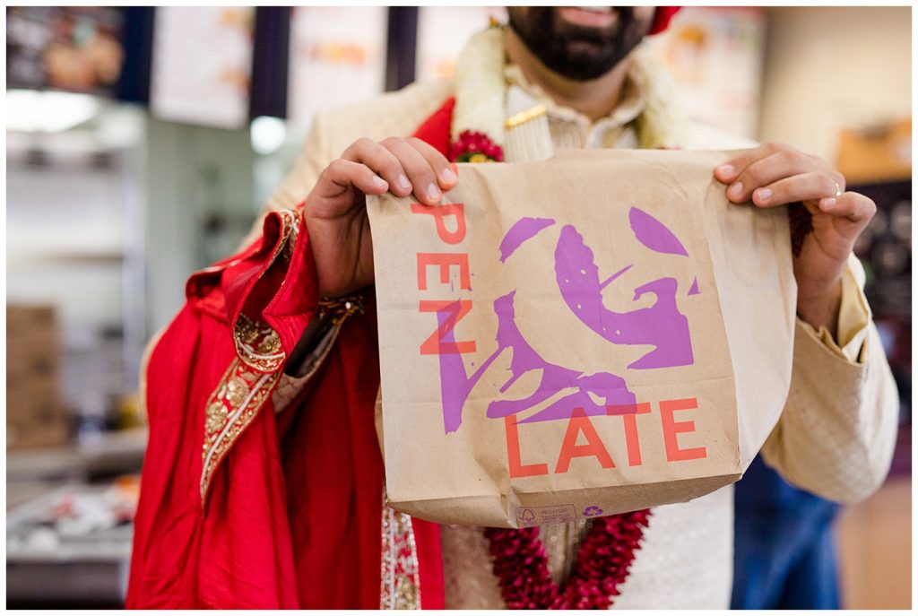 groom holding taco bell bag