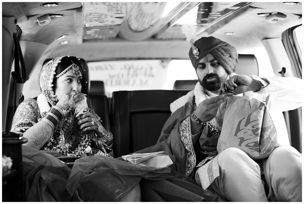 bride and groom eating taco bell in limo