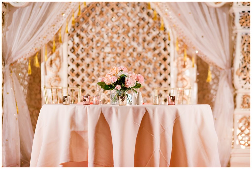 pink and white sweetheart table at reception at bertram inn