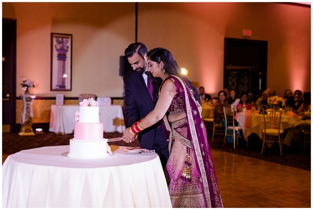 bride and groom cutting cake at bertram inn