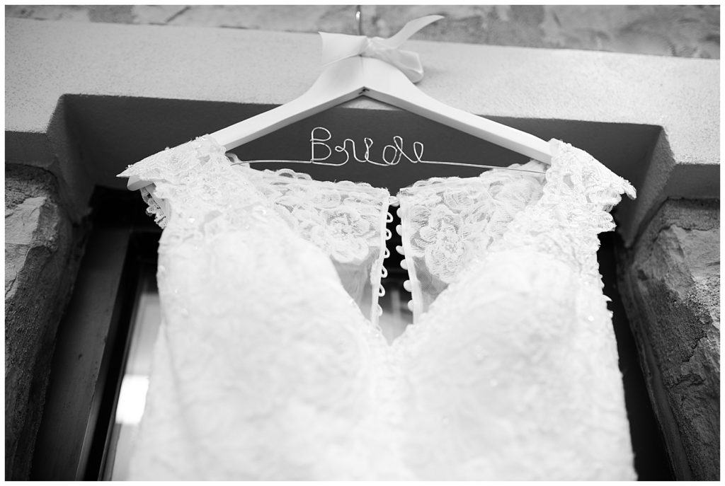 wedding dress hanging on bride hanger