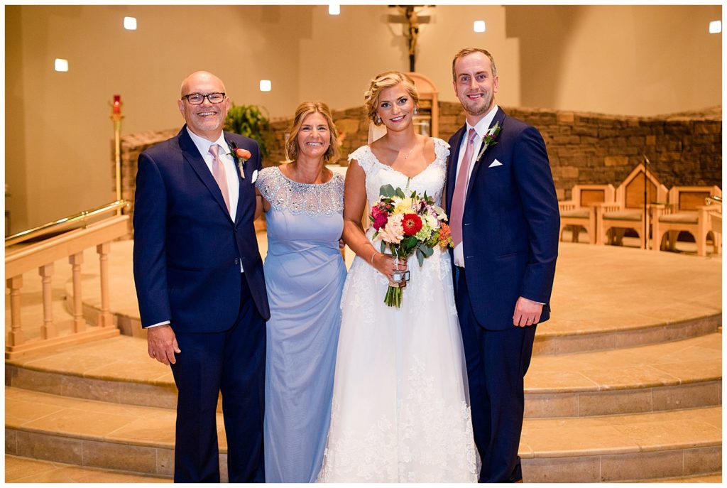 bride and groom with bride's parents