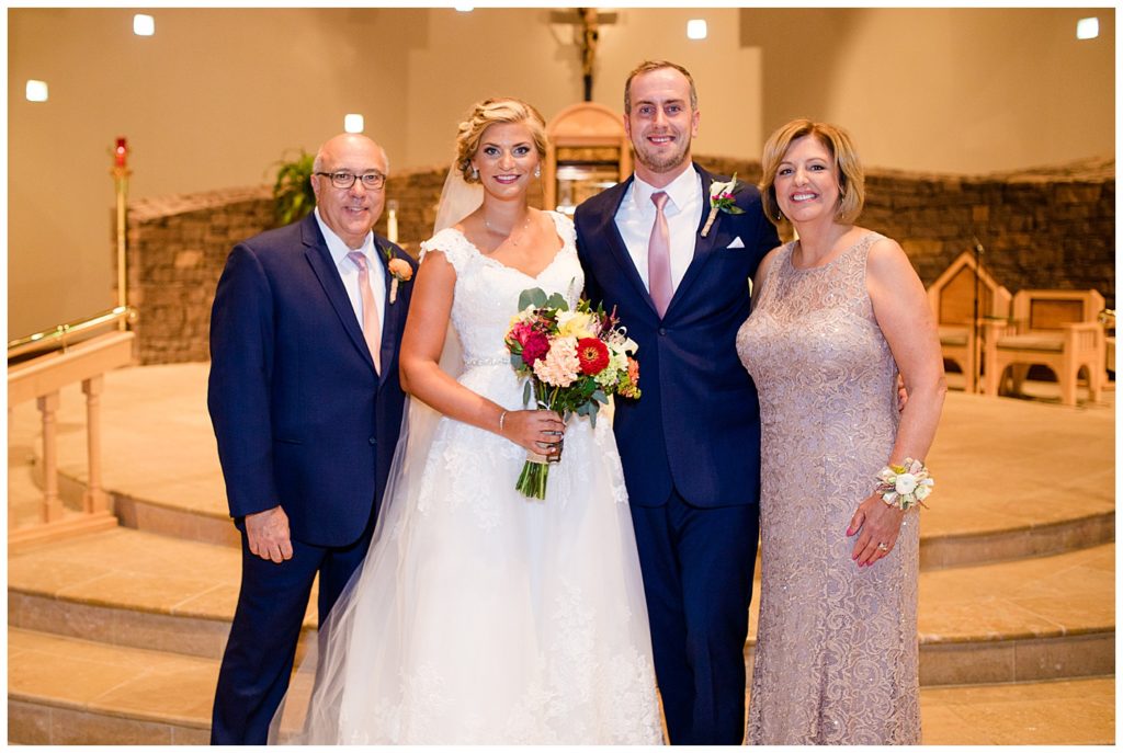 bride and groom with groom's mother and stepfather