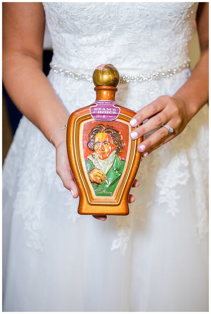 bride holding vintage whiskey