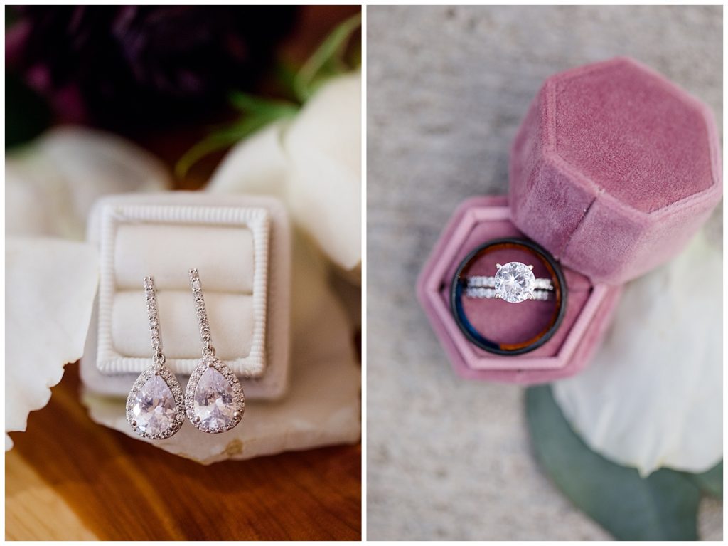 An image of a closeup view of the bride's earrings, and a display of the wedding rings at the Cedar Grove Lodge venue in Hocking Hills, Ohio by Columbus Ohio wedding photographer, Alayna Parker Photography