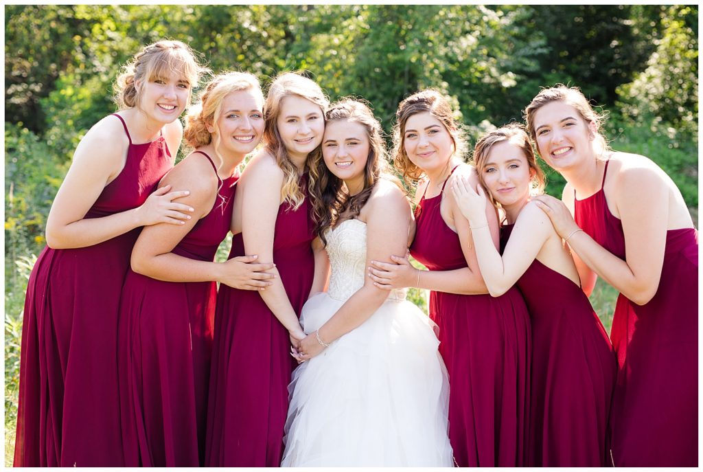 bride and bridesmaids hugging at cedar grove lodge