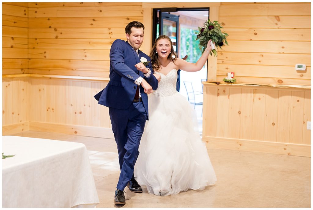 bride and groom dancing as they enter reception at cedar grove lodge