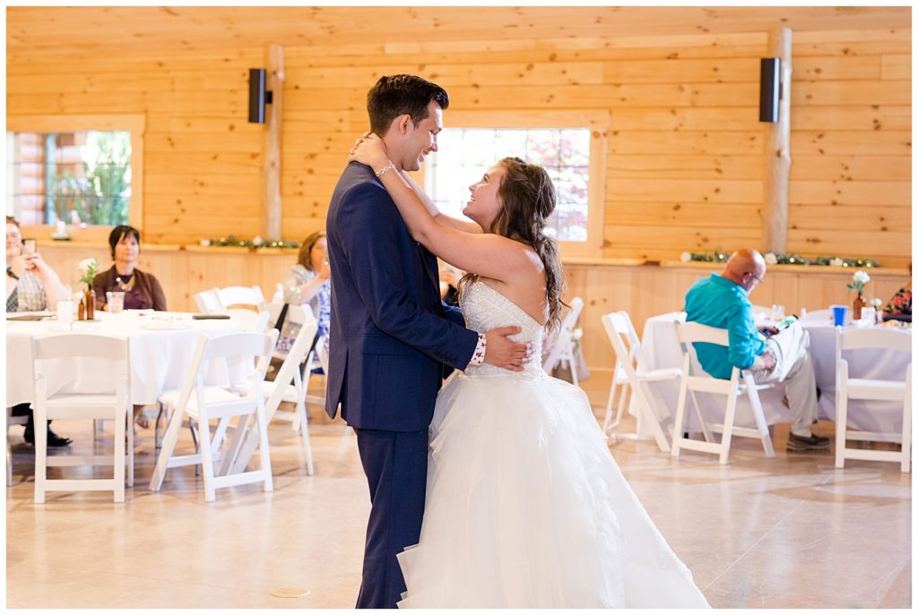 bride and groom share first dance at cedar grove lodge