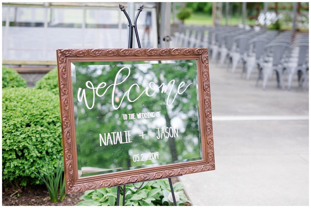 wedding welcome sign written on mirror at jorgensen farms oak grove