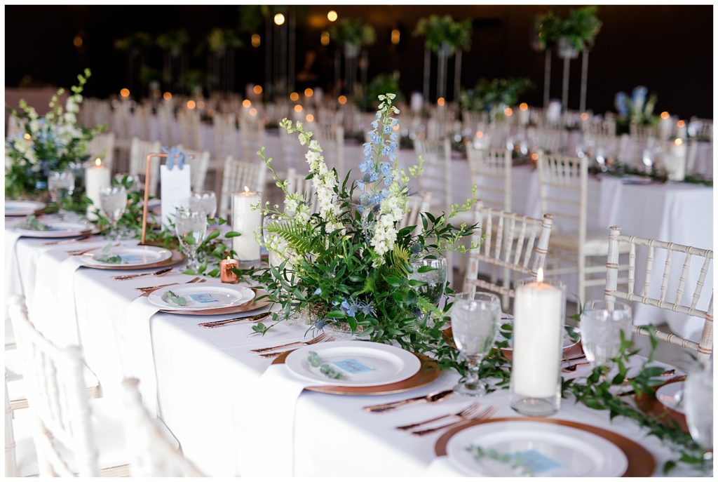 long tables with greenery garlands at jorgensen farms oak grove