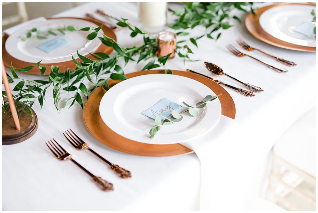 An image of a closeup view of a place setting at the wedding party table at the reception at the Oak Grove wedding venue by Columbus Ohio wedding photographer, Alayna Parker Photography