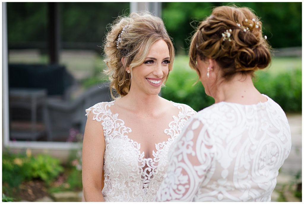 bride looking at mom at jorgensen farms