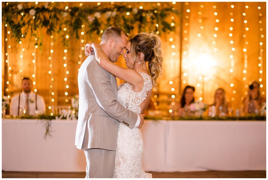 bride and groom have first dance at jorgensen farms