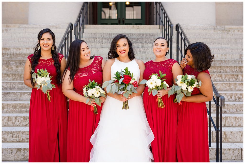 bride and bridesmaids laughing at ohio statehouse