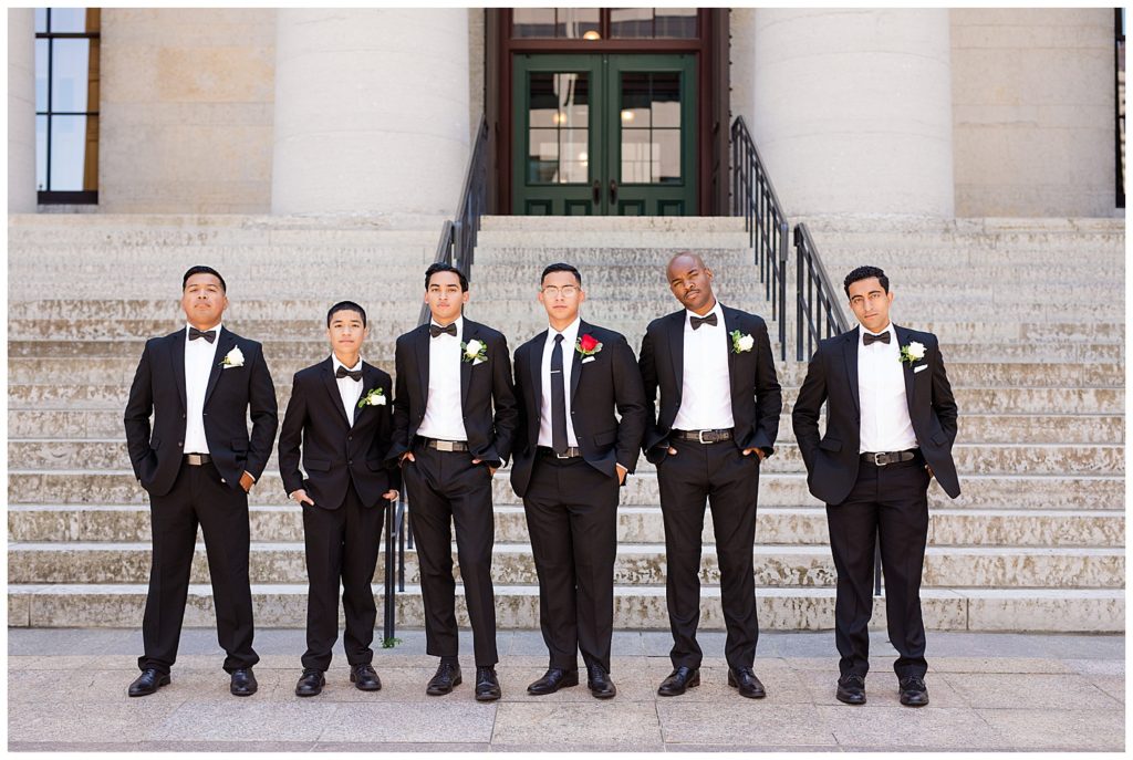 groom and groomsmen standing in front of steps at ohio statehouse