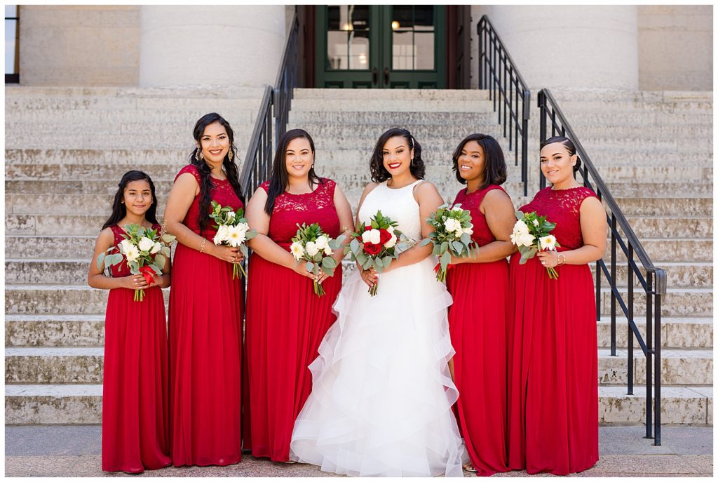 bride and bridesmaids smiling at camera at ohio statehouse